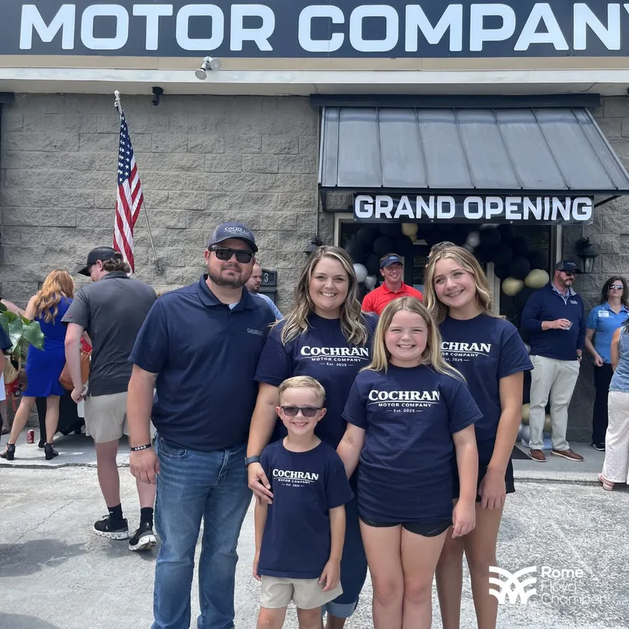 TJ Cochran and his family outside Cochran Motor Company on opening day
